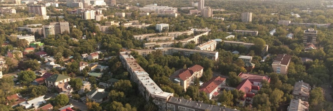 The vibrant city of Almaty, Kazakhstan, where modernity and tradition blend with stunning mountain views, from colourful street scenes to tranquil parks.